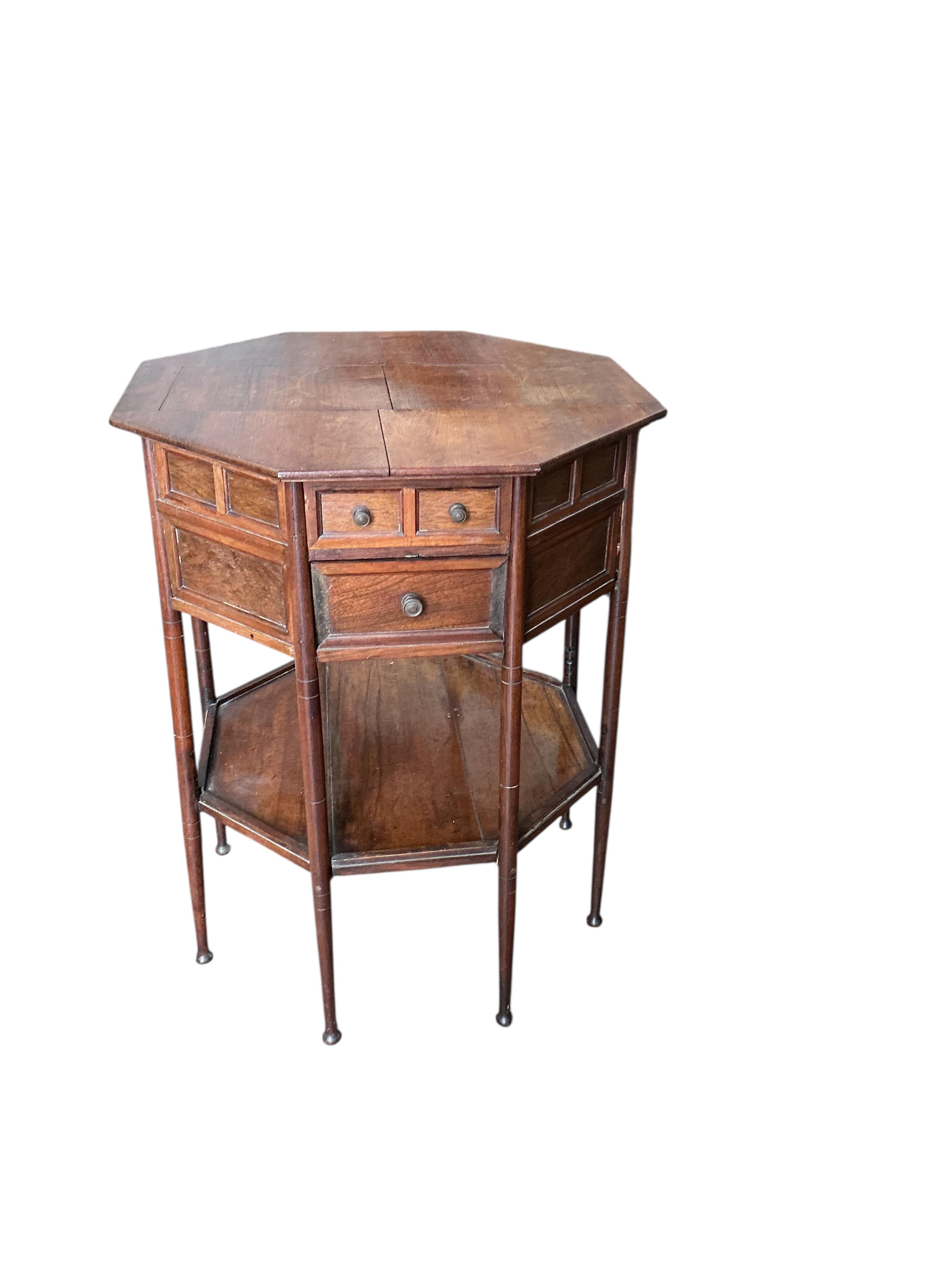 A late Victorian octagonal rosewood two tier work table, width 54cm, height 68cm